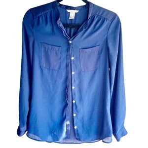 Sheer royal blue long sleeve blouse with iridescent buttons